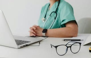 should you see a lactation consultant or doctor- doctor at desk
