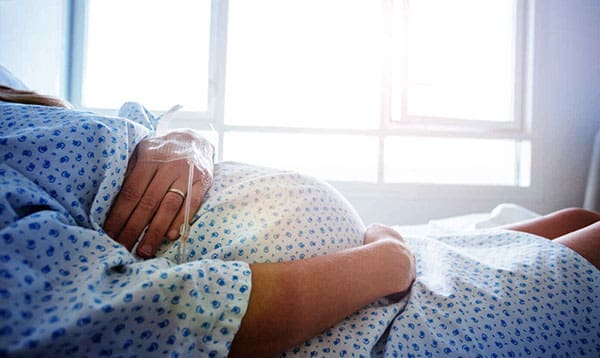 image of pregnant woman in hospital waiting to deliver a baby with induction