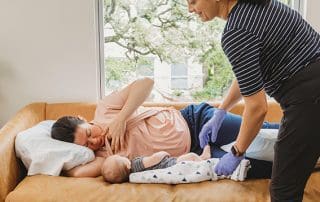 woman at a lactation consultant appointment with Breastfeeding Success