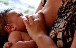 baby breastfeeding with nipple shield unsplash.com @luizabraun
