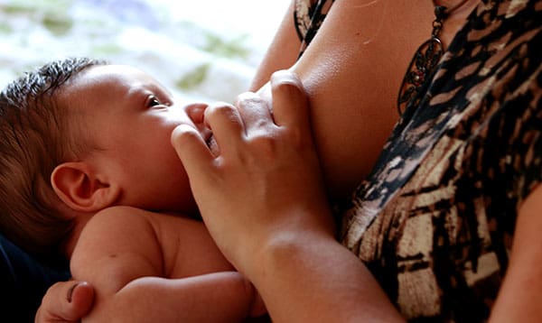 baby breastfeeding with nipple shield unsplash.com @luizabraun