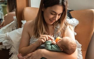 mother giving baby pacifier fearful of nipple confusion